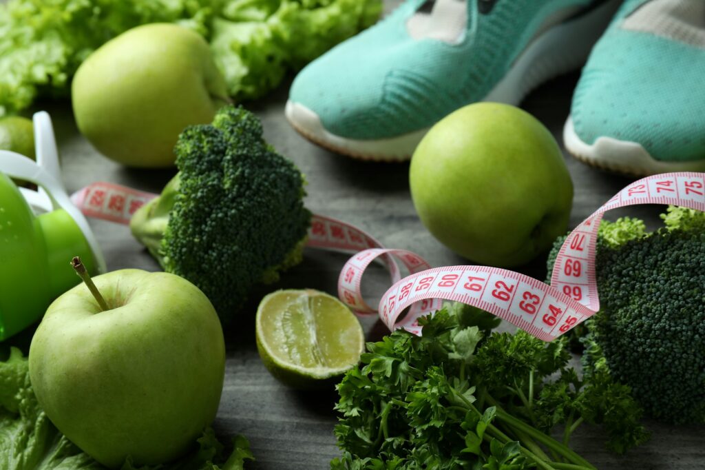 Healthy lifestyle accessories on gray textured background